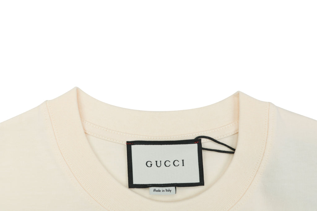 Gucci Whimsical Dinosaur Bee Illustrated Wordmark Print Short Sleeve Tee – Ecru