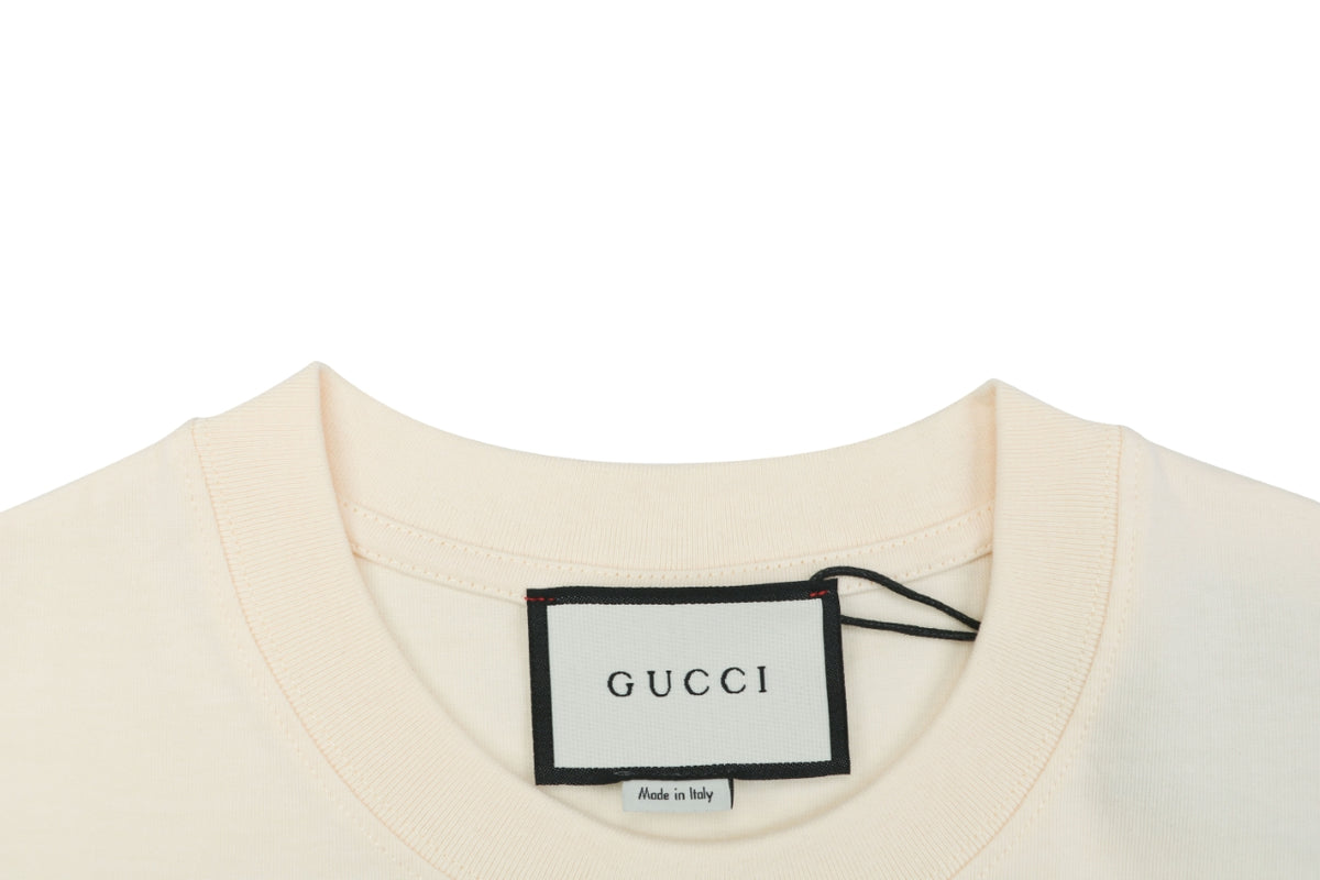 Gucci Whimsical Dinosaur Bee Illustrated Wordmark Print Short Sleeve Tee – Ecru
