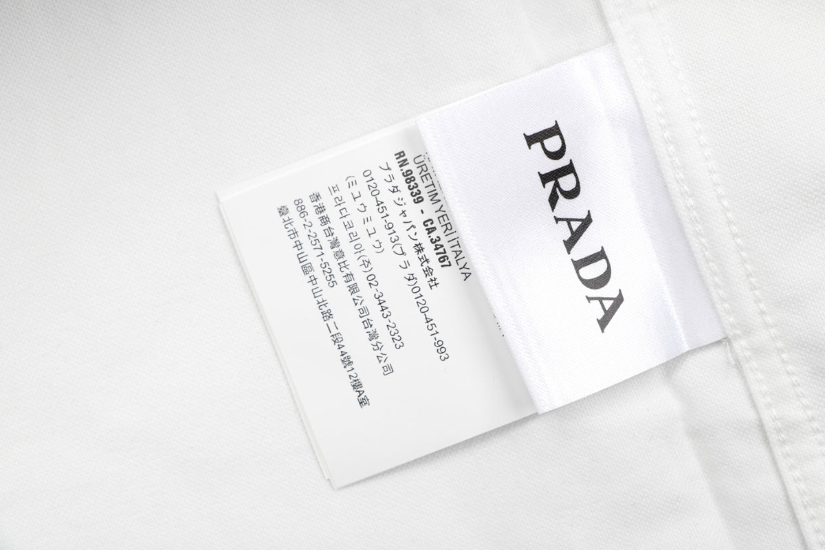 Prada PRADA Chenille Wordmark Badge Embroidered Long Sleeve Shirt – White